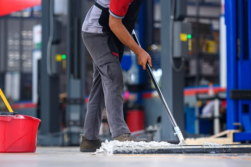 Janitor using a mop